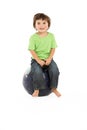 Young Boy Having Fun On Inflatable Hopper