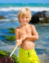 Young boy having fun on tropcial beach Royalty Free Stock Photo