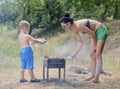 Young boy helping at the barbecue Royalty Free Stock Photo