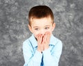 Young boy hiding face in hands Royalty Free Stock Photo