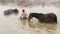 Young boy and his horse in thermal water, Guroymak, Bitlis Royalty Free Stock Photo