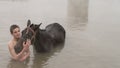 Young boy and his horse in thermal water, Guroymak, Bitlis Royalty Free Stock Photo