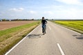 young boy on his mountain bike is on a bicycle tour along beautiful countryside