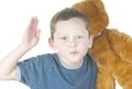 Young boy holding bear