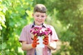 Boy holding bucket with flowers Royalty Free Stock Photo