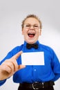 Young boy holding an empty advertising card