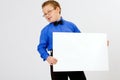 Young boy holding an empty advertising card