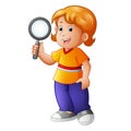 Young boy holding a magnifying lens