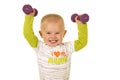 Young boy holding purple weights up Royalty Free Stock Photo