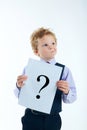 Young boy holding question mark sign. Royalty Free Stock Photo