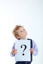 Young boy holding question mark sign isolated on white background Royalty Free Stock Photo