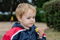 Young boy holding snack