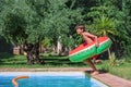 Excited kid with inflatable ring at pool& x27;s edge ready to jump Royalty Free Stock Photo