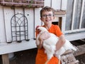 Young boy holding white hen Royalty Free Stock Photo