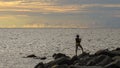 Young boy with a home fishing rod in Peace park Layang Layangan beach in Labuan Pearl of Borneo,Malaysia.