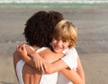 Young boy hugging his mother