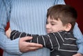 Young boy hugging his mother Royalty Free Stock Photo