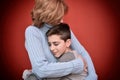 Young boy hugging his mother Royalty Free Stock Photo