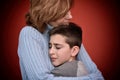 Young boy hugging his mother Royalty Free Stock Photo