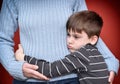 Young boy hugging his mother