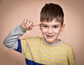 Young boy with the index finger on his head Royalty Free Stock Photo
