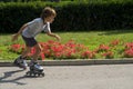 Young boy inline skating.