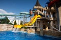 Young boy jump and having fun on a water slide in an aquapark Royalty Free Stock Photo