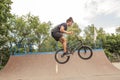 Boy jumping with BMX Bike at skate park Royalty Free Stock Photo