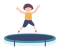 Young boy jumping happily on a trampoline, joyful kid having fun outdoors. Childhood playtime and active recreation Royalty Free Stock Photo