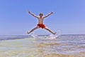 Young boy jumping out of the water Royalty Free Stock Photo