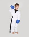 Young boy kickboxing fighter isolated on white Royalty Free Stock Photo