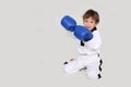 Young boy kickboxing fighter isolated on white Royalty Free Stock Photo