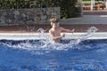 Boy plaiyng in swimming pool Royalty Free Stock Photo