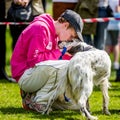 A young boy with a dog kissing his dogs nose at the Hampstead Heath dog show