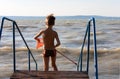 Young boy with landing net at the beach