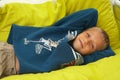 Young boy laying on pillows Royalty Free Stock Photo