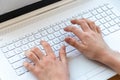 Young boy is learning to code and program at a white and elegant notebook computer for his educational future - becoming a hacker? Royalty Free Stock Photo