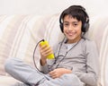 Young boy listening music headphone Royalty Free Stock Photo