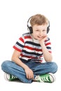 Young boy listening a music in a headphones isolated Royalty Free Stock Photo