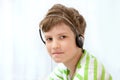 Young boy listening music on headphones Royalty Free Stock Photo