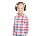 Young boy listening to music with headphones Royalty Free Stock Photo