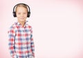 Young boy listening to music with headphones Royalty Free Stock Photo