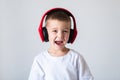 Young boy listening to music on headphones Royalty Free Stock Photo