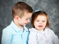 Young boy looking adoringly at little girl Royalty Free Stock Photo