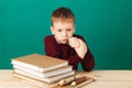 Young boy looking angry shaking his fists tired of school lesson Royalty Free Stock Photo