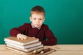 Young boy looking angry shaking his fists tired of school lesson Royalty Free Stock Photo