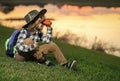 Young boy looking through binoculars. Little explorer. Outdoor recreation and adventures with kids. Child tourist on Royalty Free Stock Photo