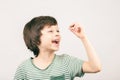 Young boy looking at his first lost milk tooth Royalty Free Stock Photo