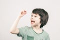 Young boy looking at his first lost milk tooth Royalty Free Stock Photo