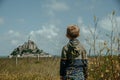 Young boy looking at Mont Saint-Michel in France Royalty Free Stock Photo